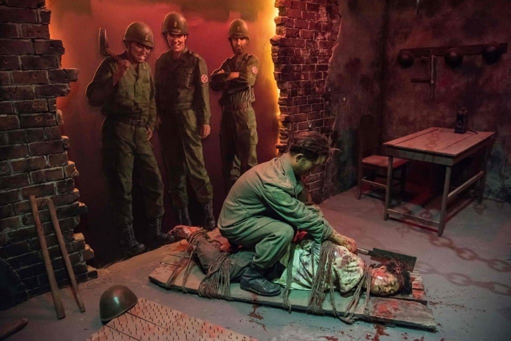 An exhibit showing US soldiers watching a South Korean soldier killing a North Korean man. Photo: AFP
