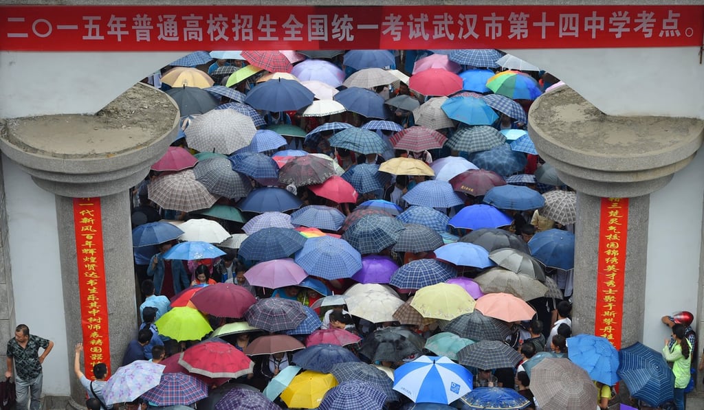 Candidates finish their gaokao exam and leave a school in Wuhan. Photo: Alamy