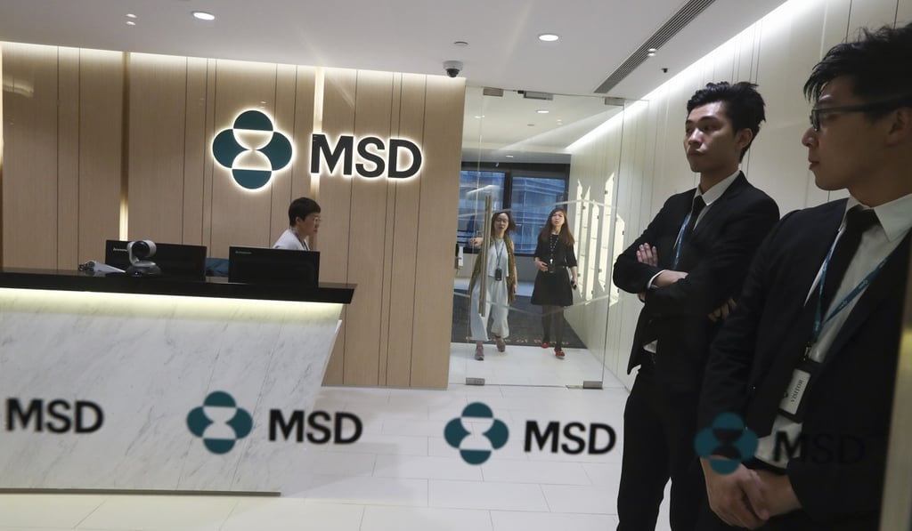 MSD staff members stand guard in the company’s reception area while the women protest outside. Photo: Nora Tam