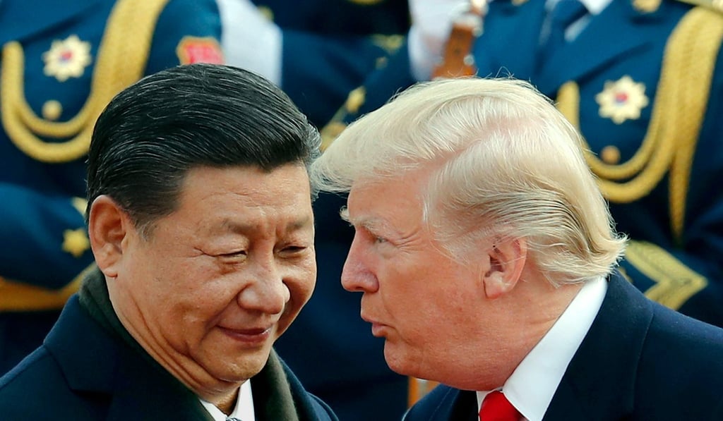 US President Donald Trump chats with Chinese President Xi Jinping. Photo: AP