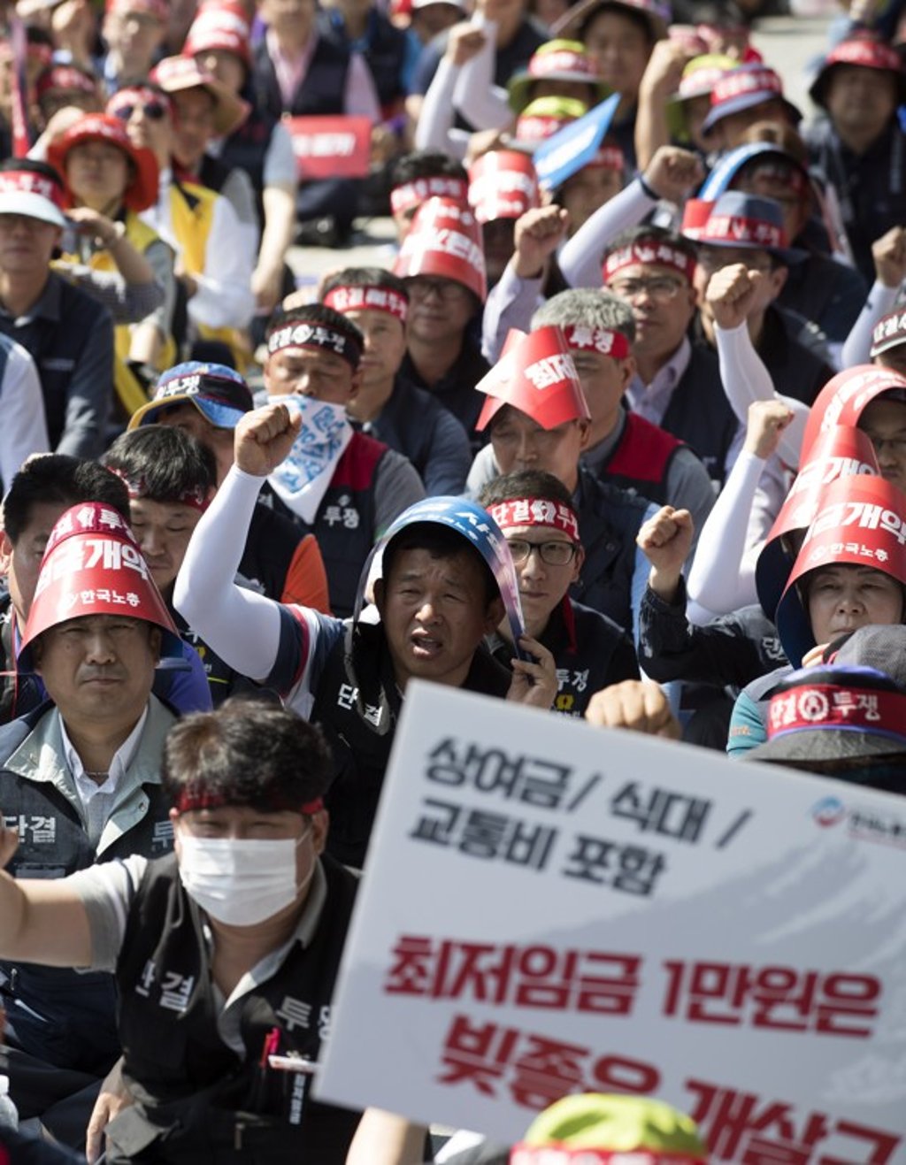 Unionised workers hold a rally in Seoul, South Korea, to call for the abolition of a revised minimum wage bill that they argue would lead to reduced real wages. Photo: EPA