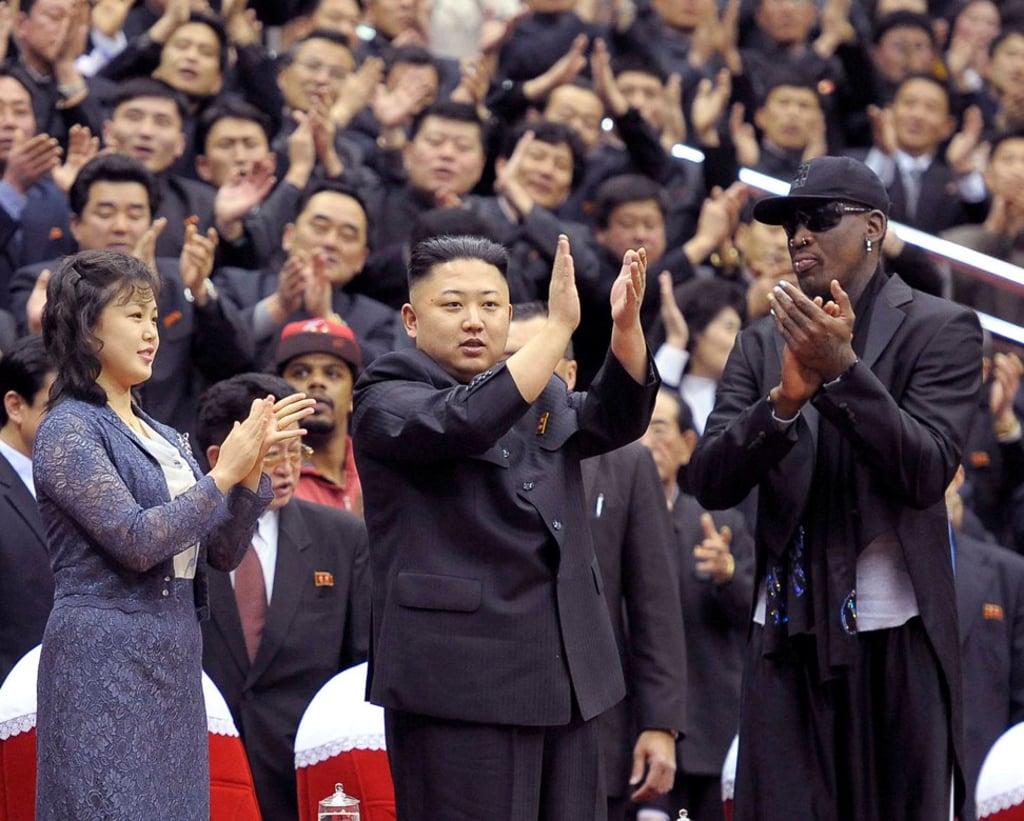 North Korean leader Kim Jong-un (centre), his wife Ri Sol-ju (left) and former NBA basketball player Dennis Rodman clap during an exhibition game in Pyongyang in 2013. Photo: Reuters