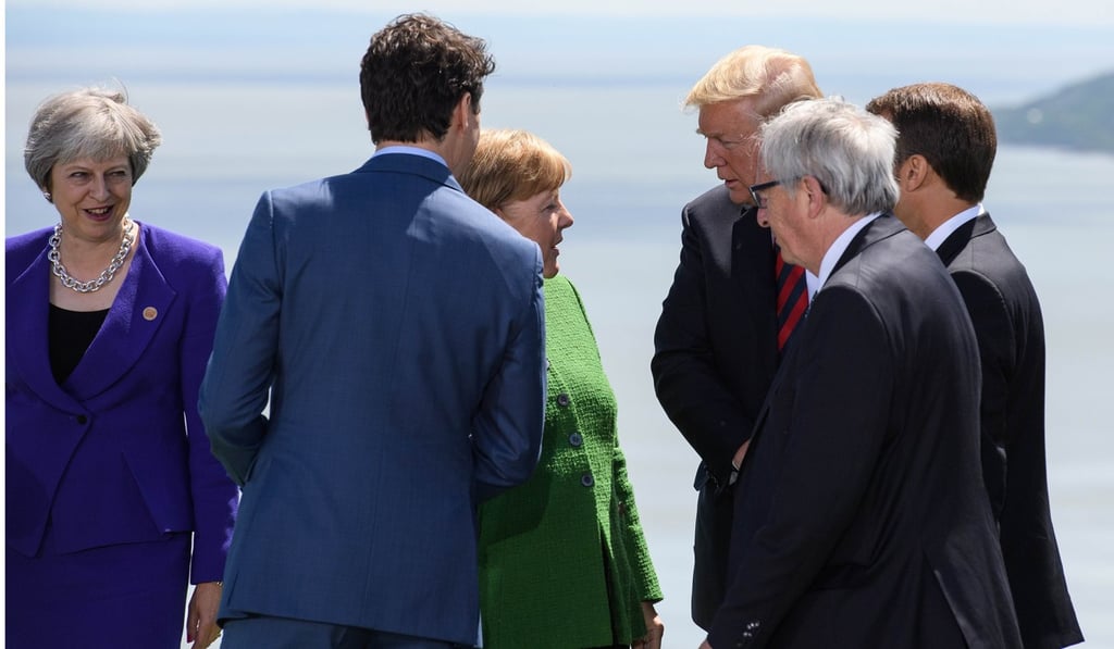 Leaders gather for a photo session on the first day of the G7 summit in La Malbaie, Canada on Friday. Photo: AFP Leaders gather for a photo session on the first day of the G7 summit in La Malbaie, Canada on Friday. Photo: AFP