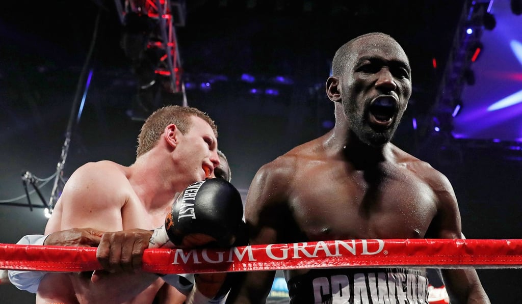Terence Crawford celebrates his ninth-round TKO victory over Jeff Horn. Photo: AFP