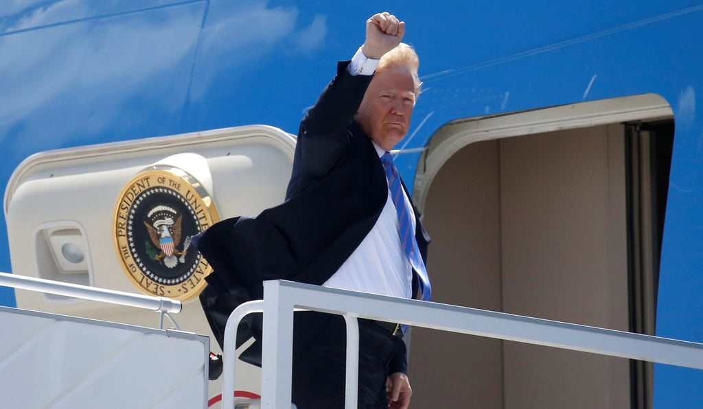 US President Donald Trump boards Air Force One to depart for travel to Singapore from Canada on Saturday. Photo: Reuters