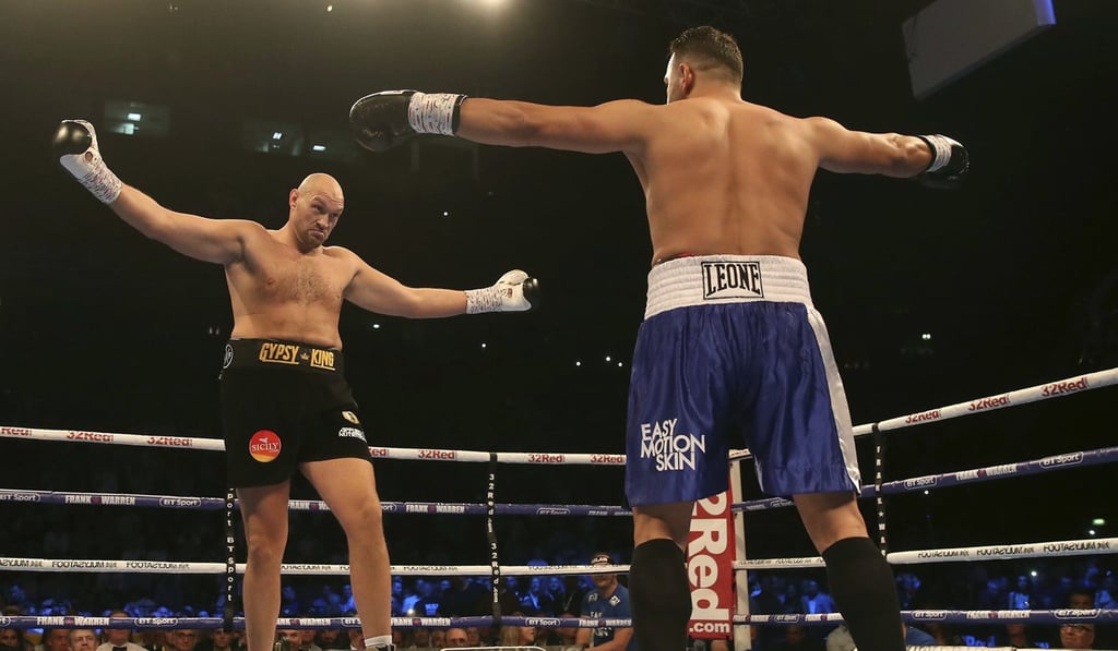 Tyson Fury and Sefer Seferi gesture to one another during their heavyweight bout. Photo: AP