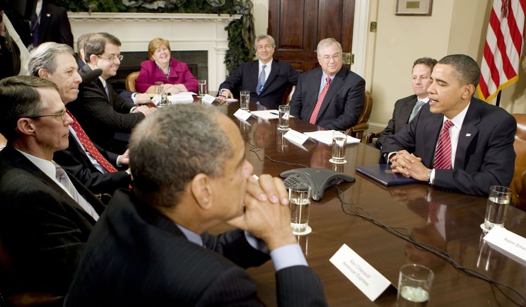 Former US president Barack Obama uses a speaker phone while meeting financial services industry leaders in the White House on December 14, 2009, to persuade them to help lift the country out of the economic crisis. Photo: Reuters