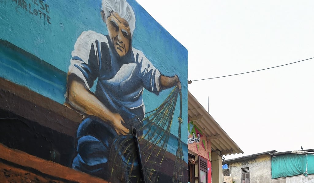 A mural at a fishing area in Mumbai. Photo: AFP