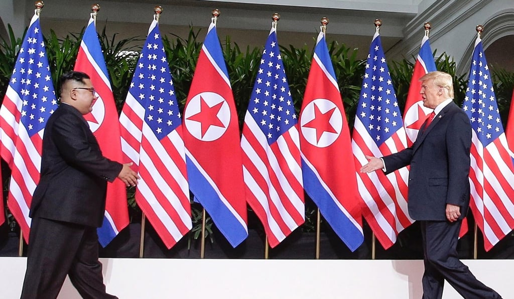US President Donald J. Trump and North Korean leader Kim Jong-un walk towards each other with outstretched hands, ready to make the historic handshake at the start of a historic summit at the Capella Hotel on Sentosa Island. Photo: EPA