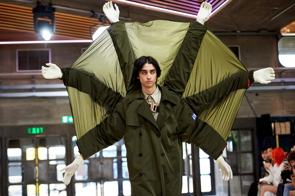 A model wears a raincoat with six sleeves, created by Chinese designer Xander Zhou, at London Men’s Fashion Week on Sunday. Photo: AFP