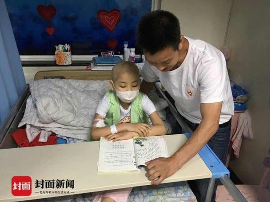 Guo Anchuan reads a book with his daughter, Guo Yuting. The nine-year-old was diagnosed with acute lymphoblastic leukaemia when she was just four. Photo: 163.com Guo Anchuan reads a book with his daughter, Guo Yuting. The nine-year-old was diagnosed with acute lymphoblastic leukaemia when she was just four. Photo: 163.com