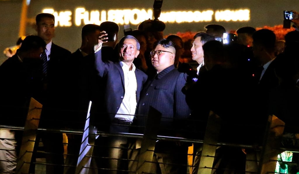 Kim poses for a selfie with Singapore Foreign Minister Vivian Balakrishnan on the Jubilee Bridge. Picture: EPA