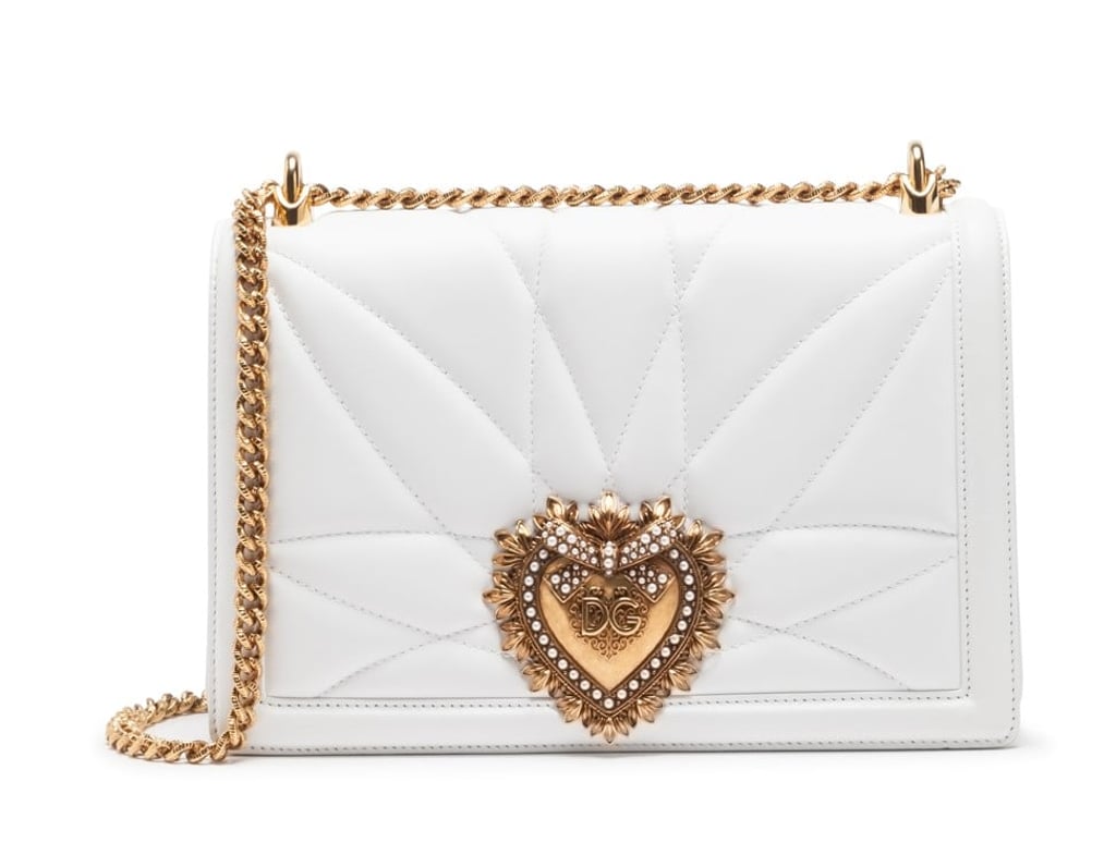 Dolce & Gabbana. The Devotion bag in quilted nappa leather is embellished with a handmade jewel heart in metal alloy with an inlay of pearls, HK $16,900