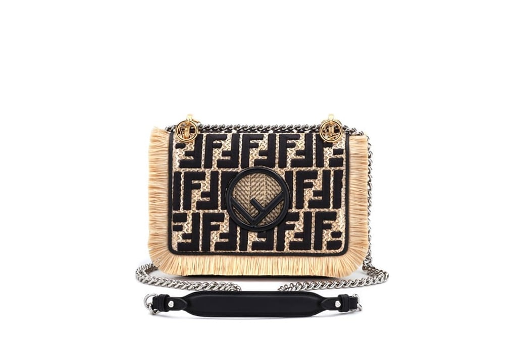 Fendi. This mini-bag is embroidered with the FF logo and decorated with fringed edges. It also features a polished black logo, HK$21,800