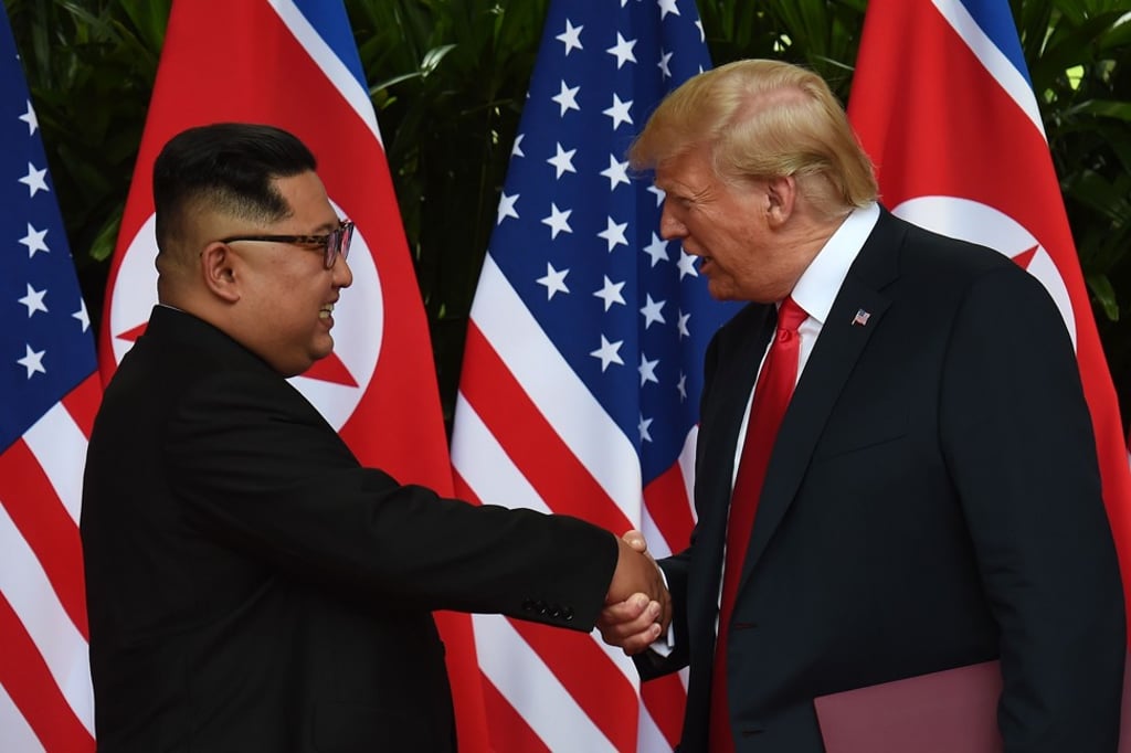 North Korean leader Kim Jong-un shakes hands with US President Donald Trump after taking part in a signing ceremony at the end of their historic US-North Korea summit on Tuesday. Photo: AFP North Korean leader Kim Jong-un shakes hands with US President Donald Trump after taking part in a signing ceremony at the end of their historic US-North Korea summit on Tuesday. Photo: AFP