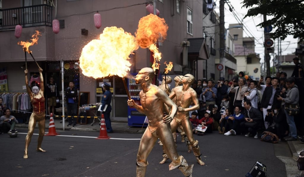 Dancers from the Japanese Butoh group “Goldens from Dairakudakan” perform during the Koenji street performance festival in Tokyo, in April 2015. Photo: EPA