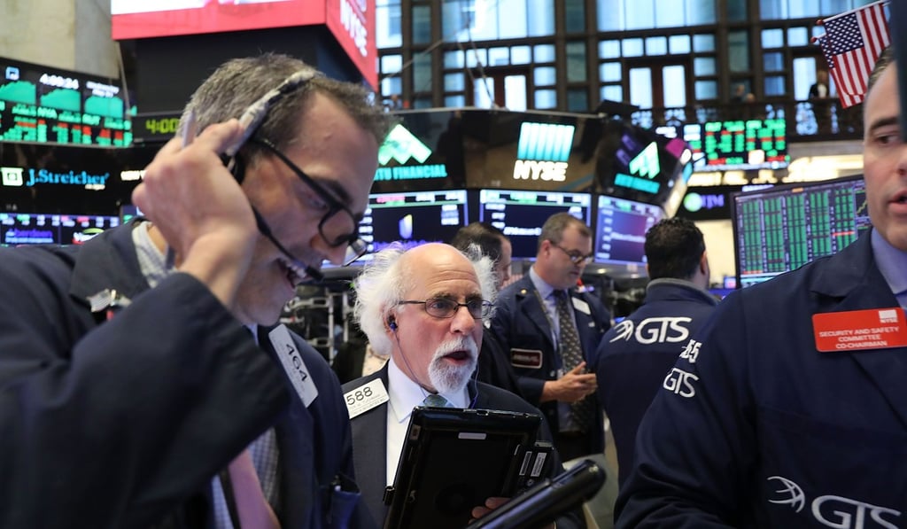 Traders work on the floor of the New York Stock Exchange on May 30. Global equity markets are up 2.6 per cent in the year-to-date with the US outperforming the global benchmark. Photo: AFP