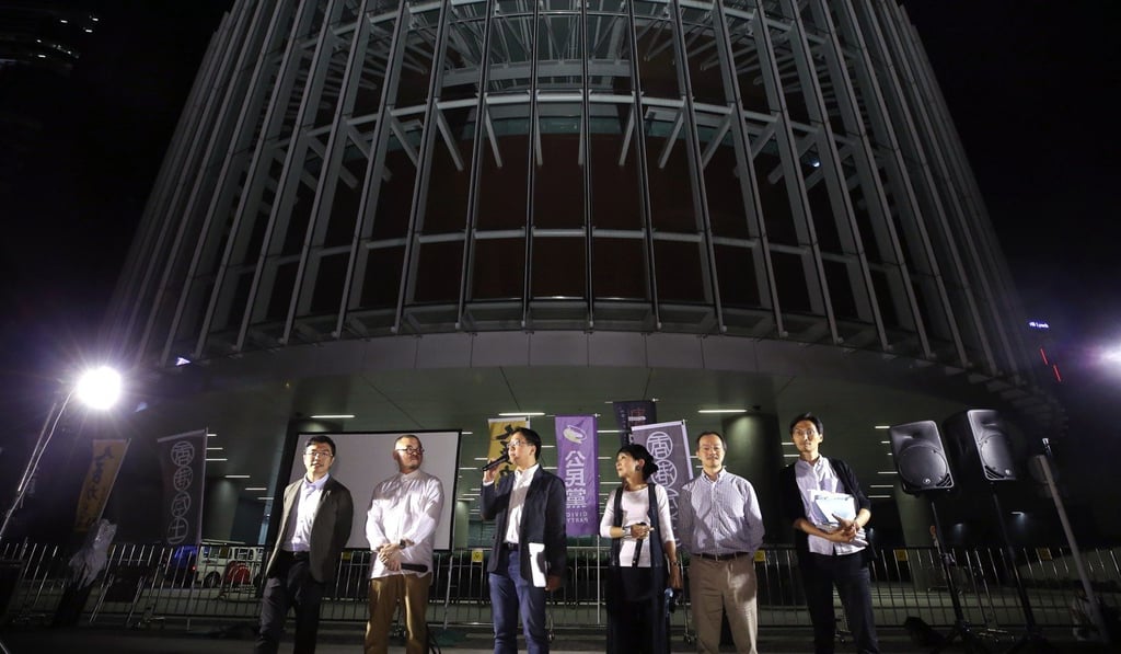 Pan-democratic lawmakers Au Nok-hin, Shiu Ka-chun, Charles Mok, Claudia Mo Meng-ching, Fernando Cheung Chiu-hung and Eddie Chu Hoi-dick speaking to protesters outside the Hong Kong legislature after the vote. Photo: Dickson Lee Pan-democratic lawmakers Au Nok-hin, Shiu Ka-chun, Charles Mok, Claudia Mo Meng-ching, Fernando Cheung Chiu-hung and Eddie Chu Hoi-dick speaking to protesters outside the Hong Kong legislature after the vote. Photo: Dickson Lee