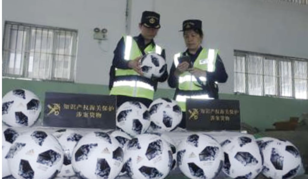 Counterfeit goods, mainly footballs and sports clothing, have been seized by customs officers in Guangzhou, Shanghai and Yiwu. Photo: Chinanews.com