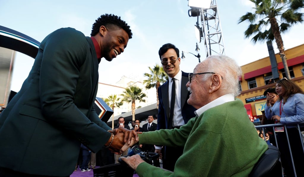 Black Panther actor Chadwick Boseman (left) greets comic book legend Stan Lee at the world premiere of “Avengers: Infinity War” in Los Angeles on April 23. In the background is Lee’s then-manager Keya Morgan. Photo: Reuters