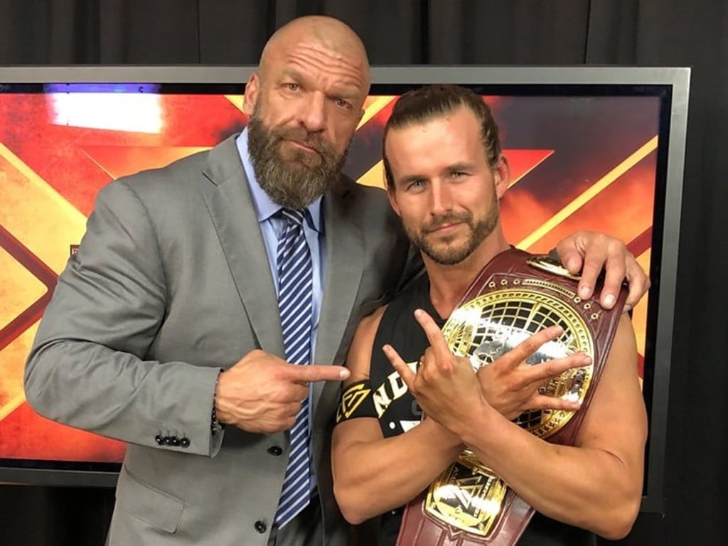 The Triple H-Kim image was mocked up from this image that Paul Levesque posted on his Twitter account, posing with Adam Cole after Cole won the NXT North American Championship. Photo: Twitter/@TripleH