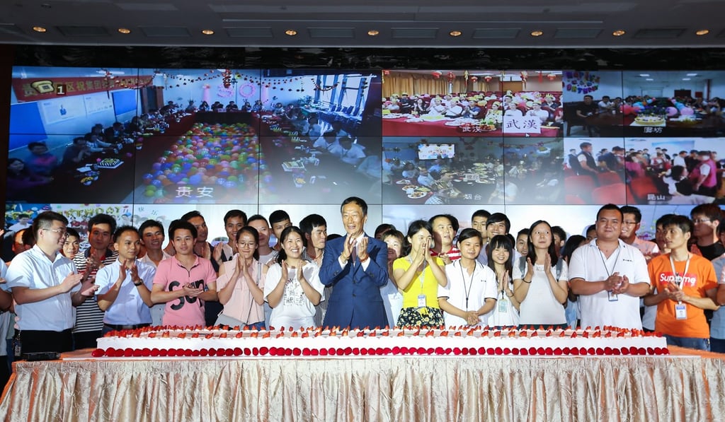 Foxconn founder Terry Gou (centre) celebrates with employees who were born on June 6, 1988. Photo: SCMP Foxconn founder Terry Gou (centre) celebrates with employees who were born on June 6, 1988. Photo: SCMP