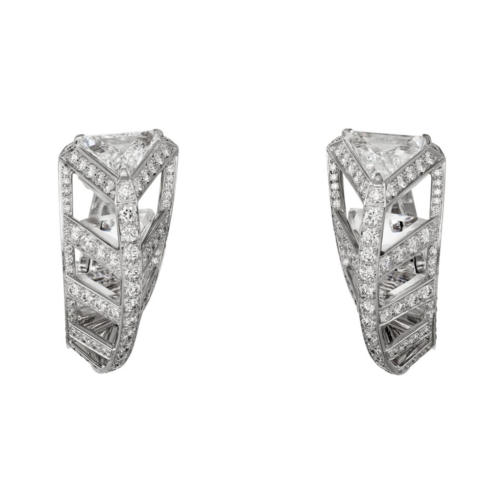 Cartier. These white gold Résonances de Cartier Twisting Light earrings feature two triangular shaped diamonds totalling 2.29ct, plus 2.1ct of brilliant-cut diamonds, and rock crystals. Price on request