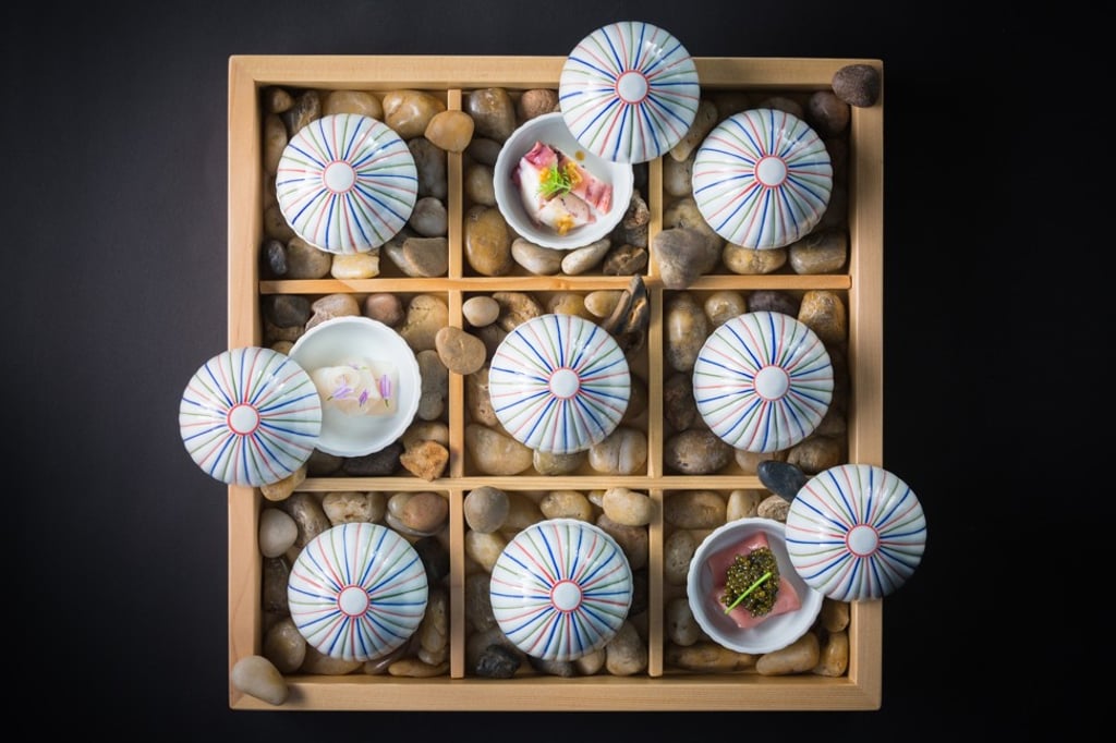 Haku’s tasting menu begins with a white wine and four types of sashimi.