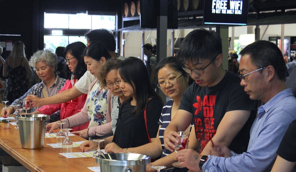 Chinese tourists sample wine at an Australian vintner. Photo: Reuters