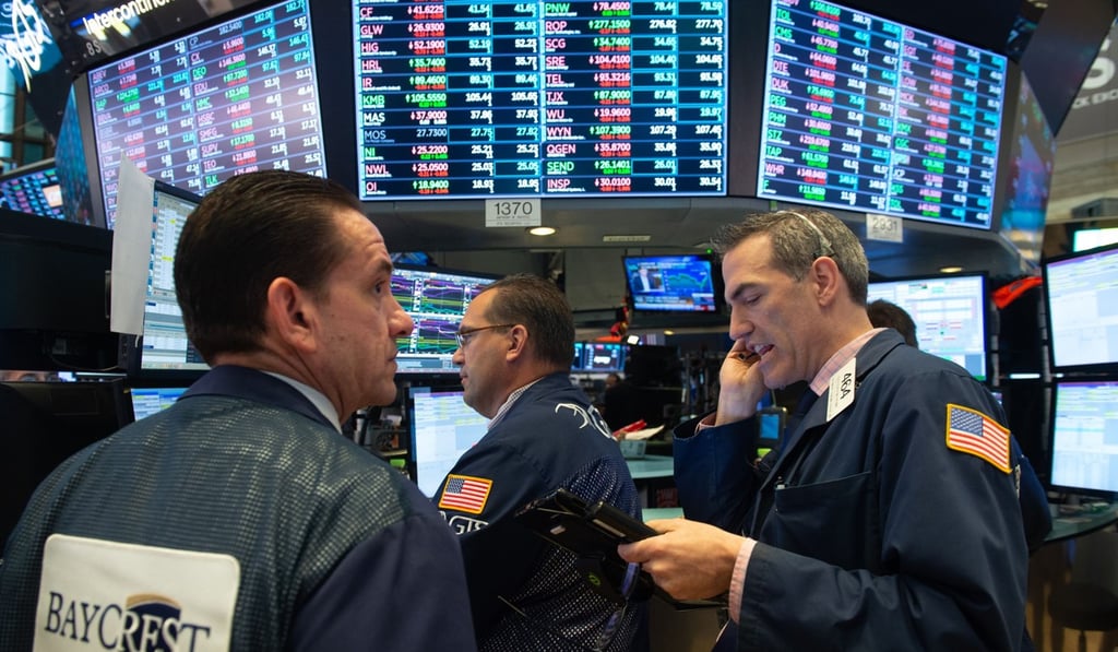 Traders on the floor of the Dow Industrial Average at the New York Stock Exchange. Photo: AFP Traders on the floor of the Dow Industrial Average at the New York Stock Exchange. Photo: AFP