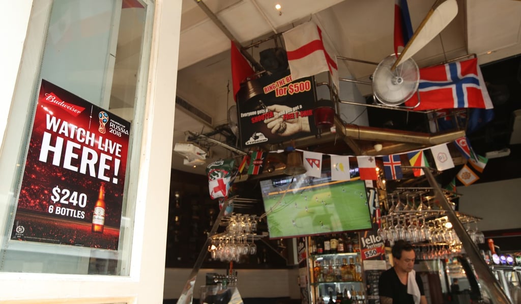 Bars in Wan Chai have put up decorations and banners ahead of the World Cup. Photo: Edward Wong