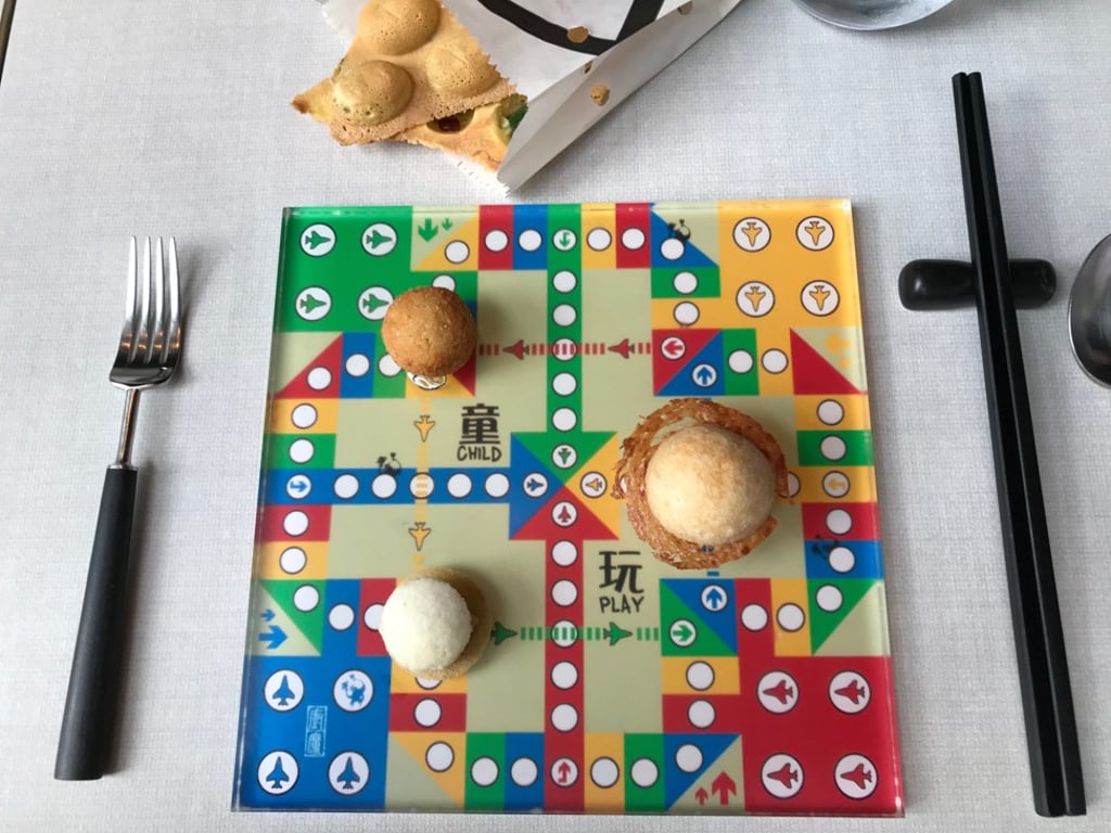 Child’s Play is inspired by curry fish balls, a combination of pineapple bun and scrambled egg toast sandwich and preserved vegetables that is usually served with braised pork belly. Photo: Bernice Chan