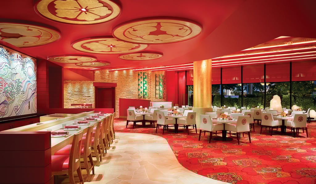 Fine-dining Japanese restaurant Mizumi at Wynn Macau is decorated in contemporary red and gold tones.