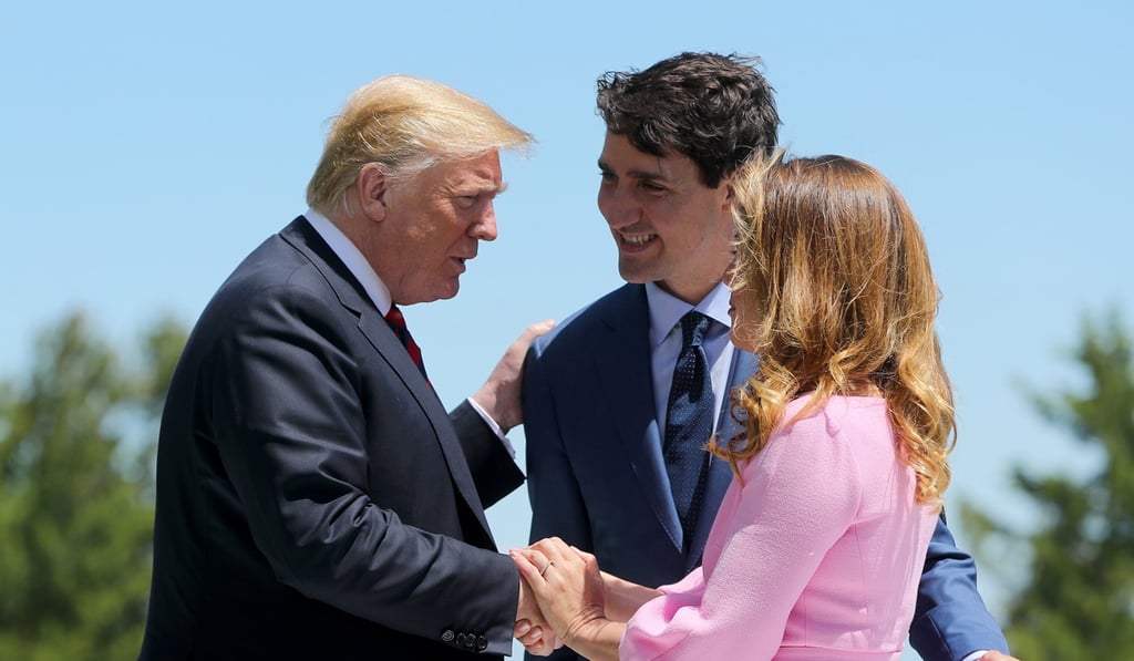 US President Donald Trump with Canadian Prime Minister Justin Trudeau and his wife Sophie Gregoire Trudeau outside the Hotel Fairmont Le Manoir for the G7 summit. Photo: TNS