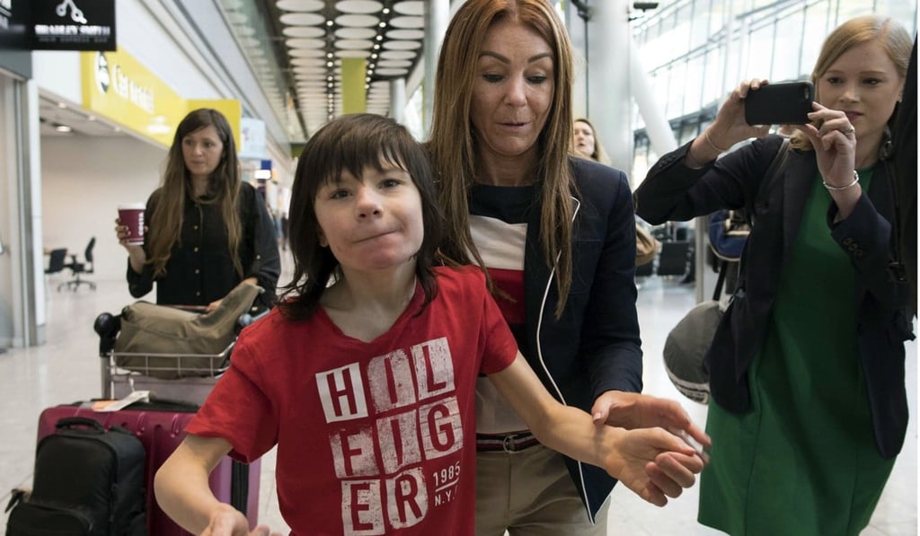 The Caldwells walking through Heathrow Airport after having the cannabis oil confiscated. Photo: AP