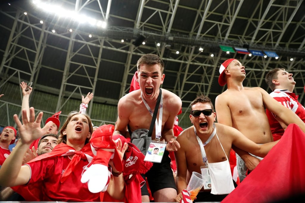 Denmark fans celebrate at the end of the match. Photo: Reuters
