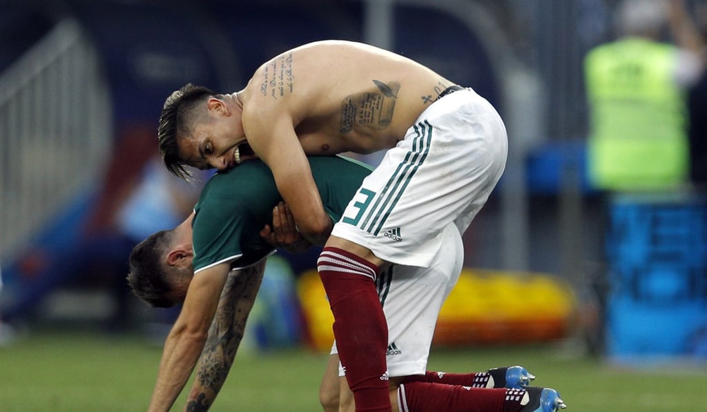Mexico's Carlos Salcedo and Miguel Layun celebrate at the end of the group F match. Photo: AP Mexico's Carlos Salcedo and Miguel Layun celebrate at the end of the group F match. Photo: AP