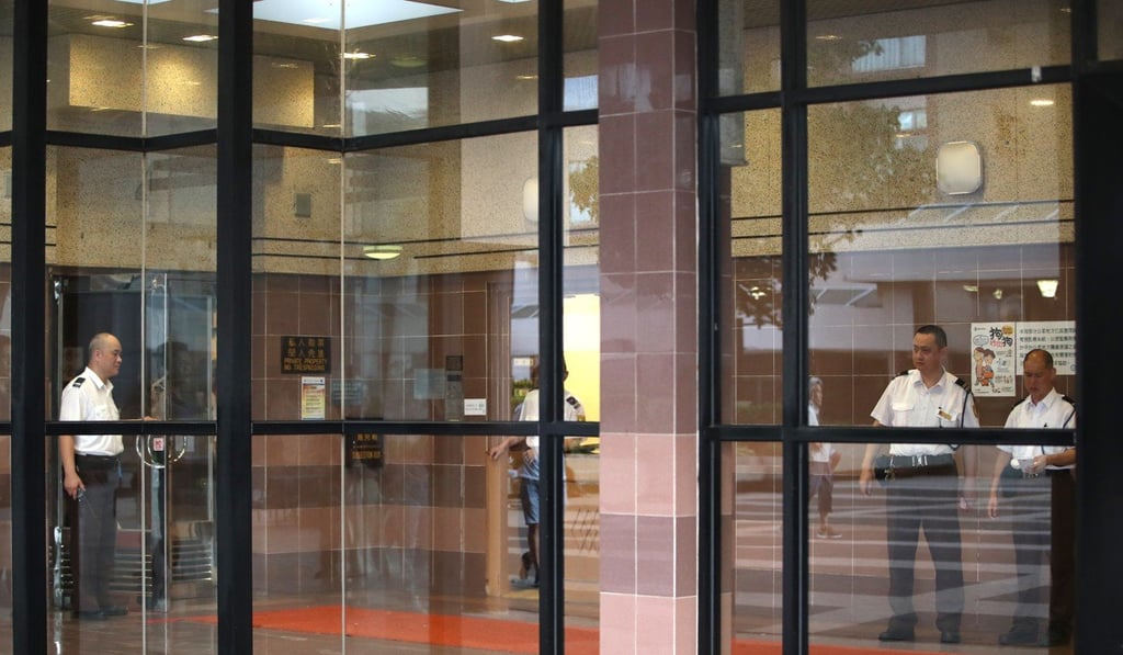 Security guards in the lobby of the Sun Tuen Mun Centre. Photo: Edward Wong