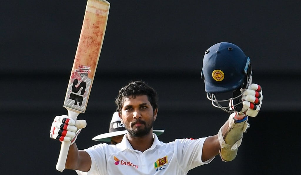 Dinesh Chandimal celebrates his century in the first innings. Photo: AFP Dinesh Chandimal celebrates his century in the first innings. Photo: AFP
