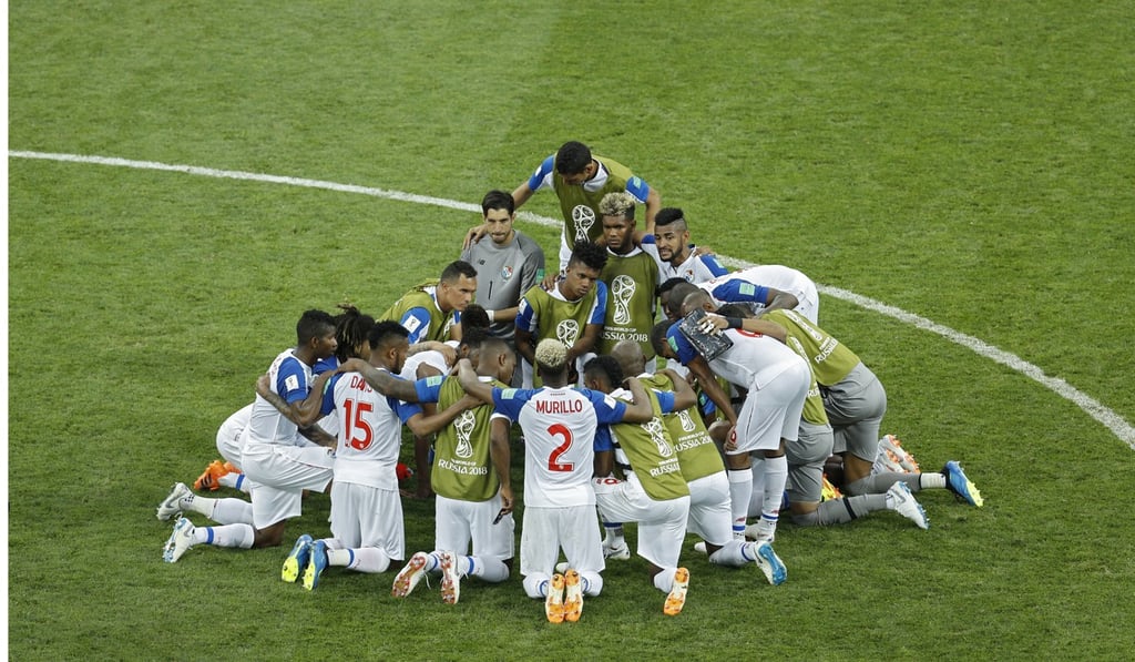 Panama players gather in a circle at the end of the match. Photo: AP