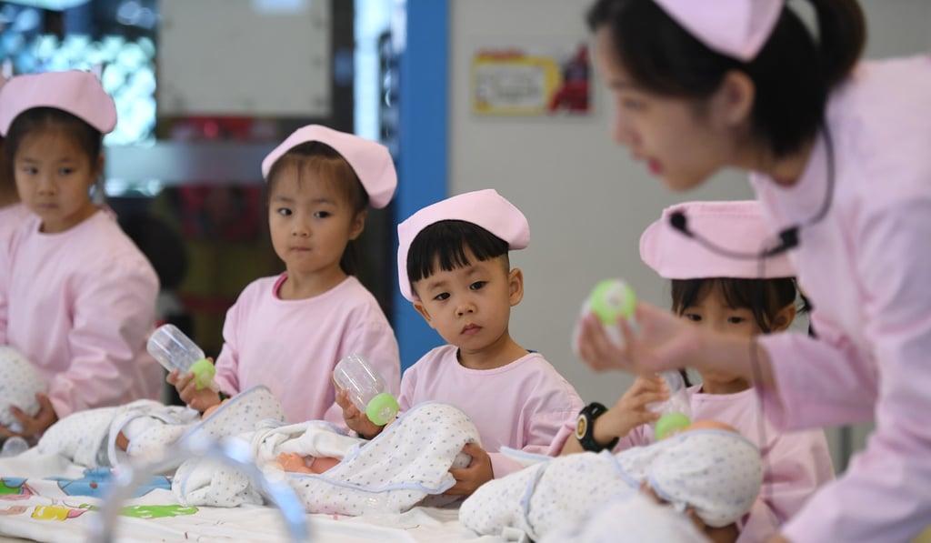 Children experience baby nursing in Hangzhou, China, in October last year. Photo: Xinhua