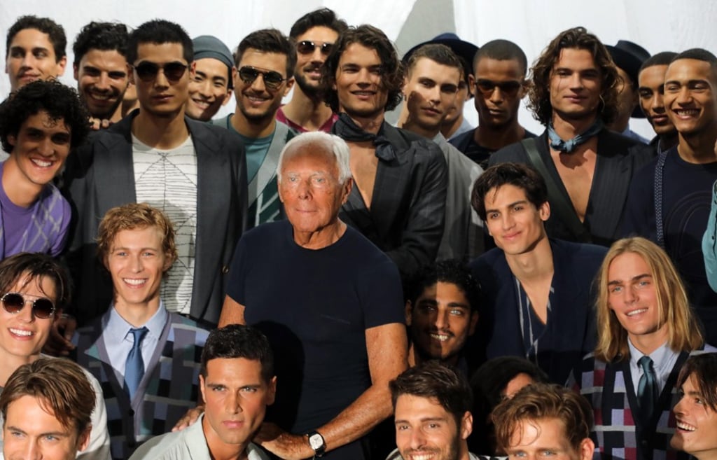 Italian designer Giorgio Armani (C) poses with models at the end of his show during the Milan Men's Fashion Week in Italy on June 18. The Milano Moda Uomo displayed spring/summer 2019 collections from June 15 to 18. Photo: EPA
