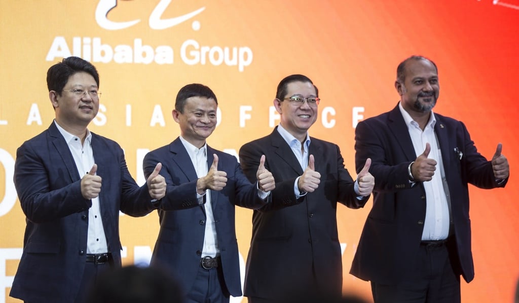 Bai Tian, China's ambassador to Malaysia, with Jack Ma, the founder of Chinese e-commerce company Alibaba, Malaysian Finance Minister, Lim Guan Eng, and Malaysian Communications and Multimedia Minister, Gobind Deo, at the opening of Alibaba’s office in Kuala Lumpur on Monday. Photo: EPA