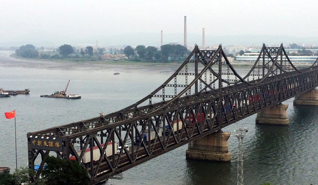 Trucks cross the friendship bridge connecting China and North Korea in Dandong. Photo: AP Trucks cross the friendship bridge connecting China and North Korea in Dandong. Photo: AP