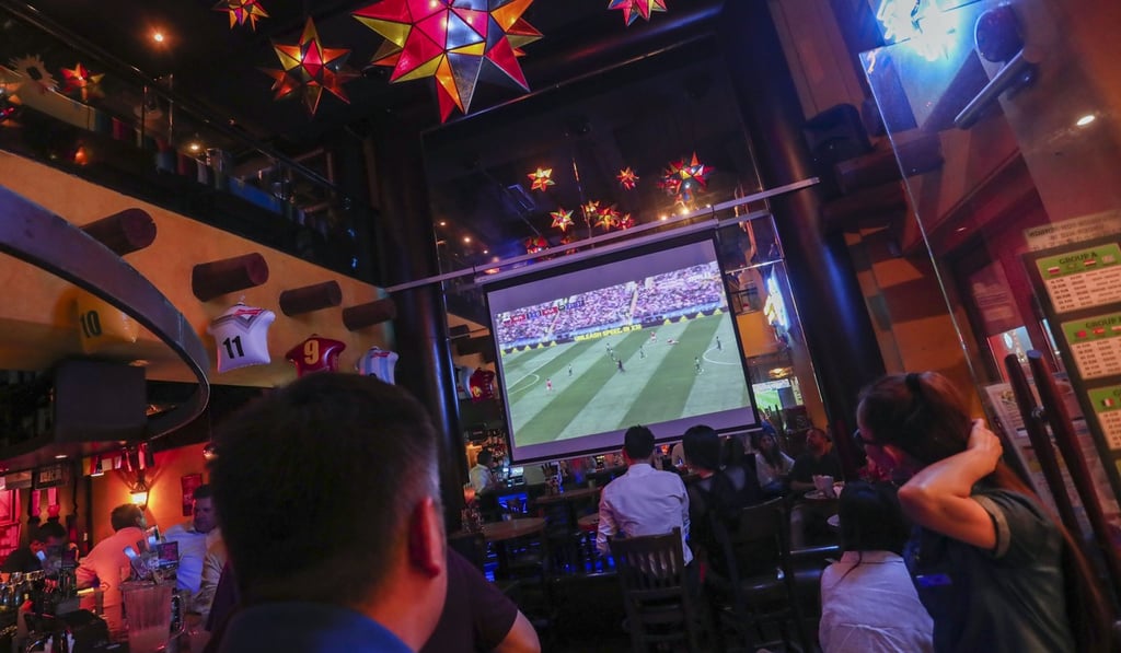 Soccer fans watch a World Cup game in Wan Chai. Photo: Jonathan Wong