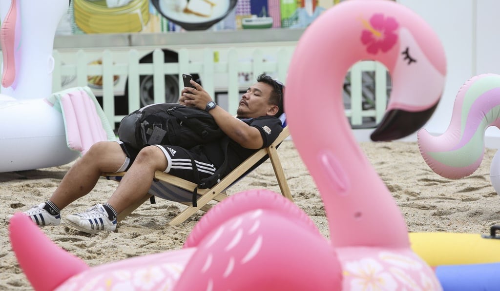 Supporters are taking in the action from a man-made beach set up on the Central harbourfront. Photo: Xiaomei Chen