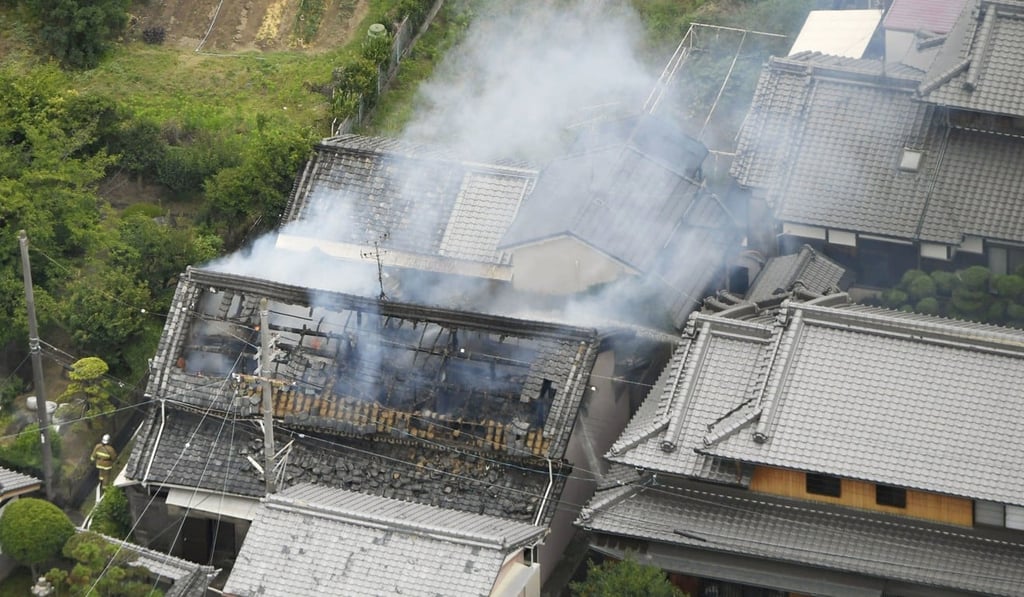 Smoke rises from a house on fire in Takatsuki, Osaka, after Monday’s quake. Photo: Kyodo Smoke rises from a house on fire in Takatsuki, Osaka, after Monday’s quake. Photo: Kyodo