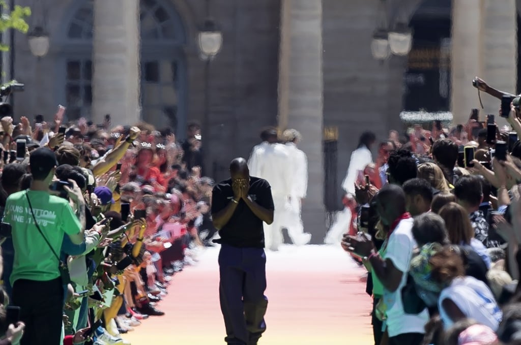 An emotional Virgil Abloh (centre) holds his head in his hands as he walks along the catwalk after his debut spring-summer menswear collection show for Louis Vuitton at Paris Men’s Fashion Week on Thursday. Photo: EPA-EFE