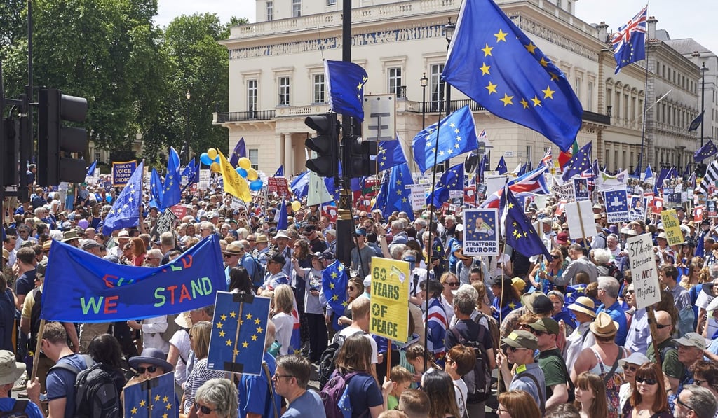 Demonstrators gather prior to the start of the People’s March. Photo: AFP Demonstrators gather prior to the start of the People’s March. Photo: AFP