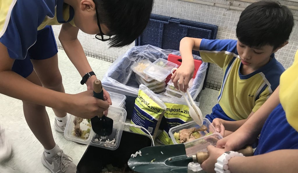 The school’s environmental ambassadors go to classrooms at the end of the lunch break, to collect leftovers. Photo: Zoe Law